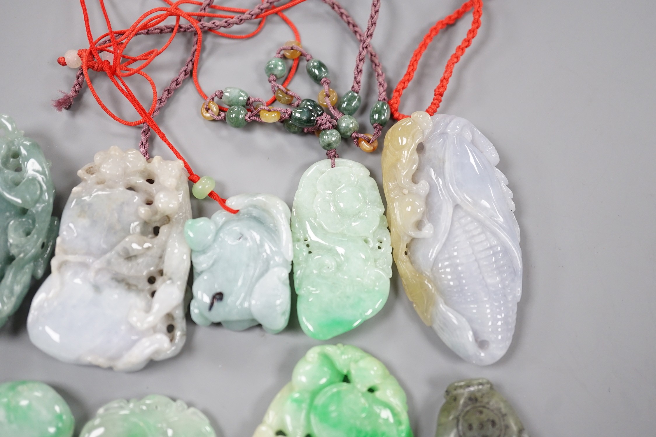 A group of ten jadeite and hardstone carvings and pendants